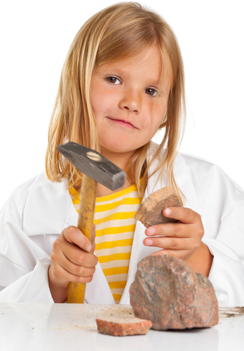 Child testing rock